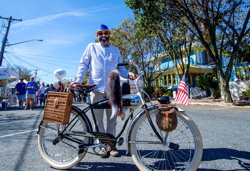 Timothy Credle tours the block party on his fancy bicycle. BY DENY HOWETH
